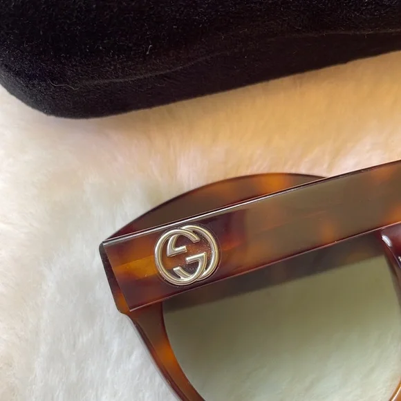 Gucci GG0028 Sunglasses feature an oversized cat-eye shape for women in brown. - Picture 8 of 11